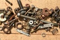 Old vintage hand tools - set of screws and nuts on a wooden background Royalty Free Stock Photo