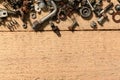 old vintage hand tools - set of screws and nuts on a wooden background with blank space for text Royalty Free Stock Photo