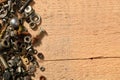 Old vintage hand tools - set of screws and nuts on a wooden background with blank space for text Royalty Free Stock Photo