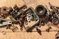 old vintage hand tools - set of screws and nuts on a wooden background Royalty Free Stock Photo