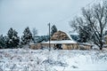 Old vintage historic barn on farm covered in snow Royalty Free Stock Photo