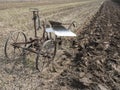 Old vintage horse drawn plow on field in holland Royalty Free Stock Photo