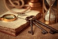 Old vintage items of the treasure hunter, traveler and discoverer - a magnifying glass, old manuscripts, a globe, keys to chests. Royalty Free Stock Photo