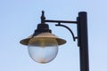 Old vintage lantern against blue sky background