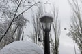 Old Vintage Lantern Covered With Snow. Street Vintage Lamps In A Winter Snow-covered Park