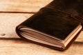 Old vintage leather book on wooden background Royalty Free Stock Photo