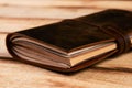 Old vintage leather book on wooden background Royalty Free Stock Photo