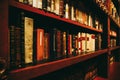 Old vintage library bookshelves, books on the shelves