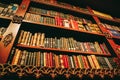 Old vintage library bookshelves, books on the shelves