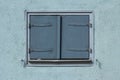 Old vintage light blue closed wooden window shutters Royalty Free Stock Photo