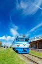 Old vintage locomotive against wonderful clouds and sky