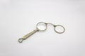 Old vintage lorgnette from the middle of the nineteenth century on the white background