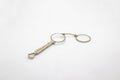 Old vintage lorgnette from the middle of the nineteenth century on the white background