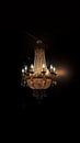 Old vintage luxury rich chandelier on dark background. AI generative Royalty Free Stock Photo