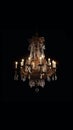 Old vintage luxury rich chandelier on dark background. AI generative Royalty Free Stock Photo