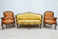 Old vintage luxury sofa and pair of armchairs. Royalty Free Stock Photo