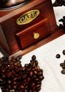 Old vintage manual coffee grinder with coffee beans