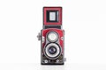 Old vintage medium square format twin lens reflex camera wrapped in red leatherette front view isolated on white background Royalty Free Stock Photo