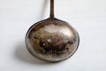 Old vintage metal soup ladle on a table Royalty Free Stock Photo