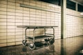 Old vintage metal stretcher in horror hospital