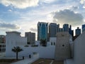 Old vintage Middle Eastern building  and towers surrounded by modern skyscrapers - Qasr Al Hosn in Abu Dhabi city Royalty Free Stock Photo