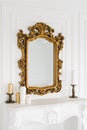 Old vintage mirror with gold colored wooden ornament frame