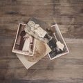 Old vintage monochrome photographs in sepia color are scattered on a wooden table, the concept of genealogy, the memory of