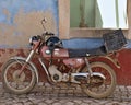 Old vintage moped from the 70`s and traditional wall Royalty Free Stock Photo