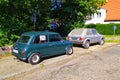 Old vintage Morris Mini Cooper and Golf I parked Royalty Free Stock Photo