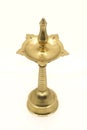 old vintage oil wick lamp or vilakku made of golden brass Royalty Free Stock Photo