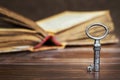 Old opened bible book and key, faith, pray background Royalty Free Stock Photo