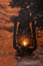 Old vintage petrol lamp with light on in the snow Royalty Free Stock Photo