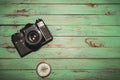 Old vintage photo camera with compass on wooden background Royalty Free Stock Photo