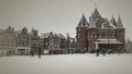 Old vintage photo from the Nieuwmarkt in Amsterdam Netherlands in winter