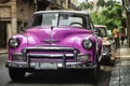 Old vintage, pink car at the Classic cars park in Havana, Cuba