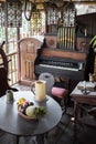 Old vintage pipe organ and table with fruits is Royalty Free Stock Photo