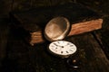 Pocket watch with an old antique bible book and ancient copper c Royalty Free Stock Photo