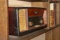 Old vintage radio on the wooden shelf