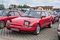 Old vintage red car Mazda 323F fasback