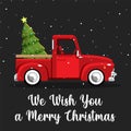 Old vintage red Christmas truck with pine tree