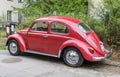 Old vintage red VW Beetle 1200 ccm parked Royalty Free Stock Photo