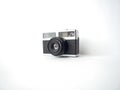 Old vintage reel camera on a white backgrownd Royalty Free Stock Photo