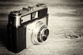 Old vintage retro camera on wooden background Royalty Free Stock Photo