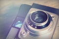 Old vintage retro camera on wooden background Royalty Free Stock Photo
