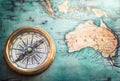 Old vintage retro compass on ancient map background. Travel geog Royalty Free Stock Photo