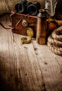 Old vintage retro compass, binoculars and spyglass on wooden tab Royalty Free Stock Photo