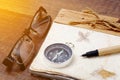 Vintage retro compass with a book travel concept background. Royalty Free Stock Photo