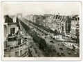 Old vintage paper photo print of Arc de Triomphe with historic axis in Paris, old cars traffic in 1934 Royalty Free Stock Photo