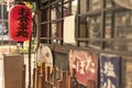 Old vintage retro japanese metal signs and red rice paper lantern where it is written 