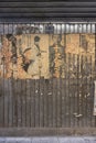 Old vintage retro japanese samurai movie posters and rusty metal advertising sign of old sake brand on underpass Yurakucho Concour